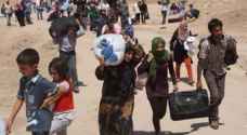 بغداد تنقل 1400 نازح عراقي من سوريا الى مخيم العلم