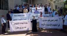 "الأطباء" يعتصمون أمام المجلس الطبي الأردني.. صور