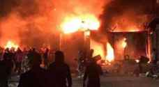 شاهد .. محتجون عراقيون يضرمون النار بقنصلية ايران في النجف