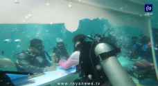 عاشقان تايلانديان يعقدان قرانهما تحت الماء بمناسبة "عيد الحب".. فيديو