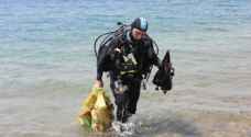 "الهيئة البحرية" ترفع 2 طن نفايات بحرية من جوف البحر